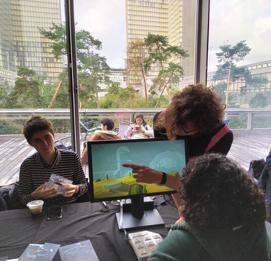 A younger Paul presenting the game at Indiecade Europe